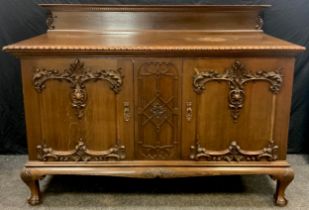 A Gothic style oak Buffet sideboard, quarter-galleried over-sailing top with gadrooned edge, over