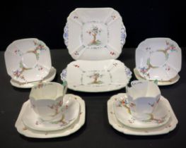 A Shelley ‘Crabtree’ part tea service comprised of; a pair of picnic plates, two tea cups,