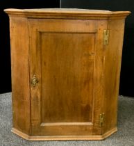 A 19th century oak wall mounted corner cupboard, 92cm high x 84cm wide x 40cm deep.