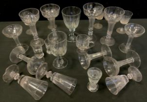 George III and later glassware - two pairs of champagne coups, faceted hollow stems, irregular feet,