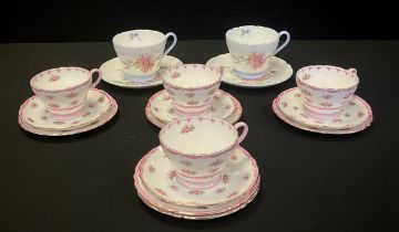 Shelley - a pair of Shelley tea cups and saucers, pattern no.2277, decorated with chrysanthemums;