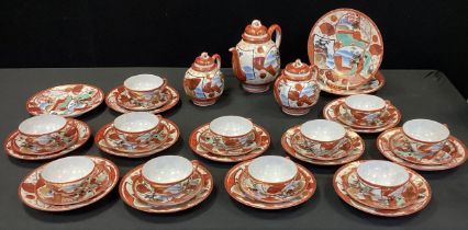 A Japanese Kutani porcelain tea set, inc teapot, water jug, sugar bowl, eleven cups and saucers ,