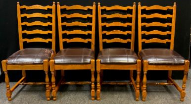 A set of four oak ladder-back dining chairs, 105cm high x 48cm wide, (4).