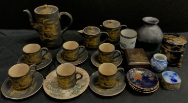 A mid century satsuma tea set for four in black and gilt; 1920s satsuma spice jar on tri pod feet,