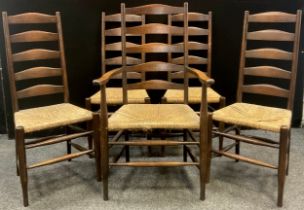 A set of five late 19th century ladder back rush seated dining chairs, comprising four chairs, and a