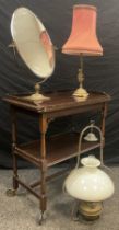 A Reproduction games table drinks trolley, fold-over top, shelf under tier, turned legs, castor