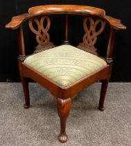 A 19th century walnut corner open arm chair, carved ‘endless-knot’ splats, drop in seat, cabriole