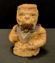 An Austrian terracotta novelty tobacco jar, as a dog dressed in a smoking jacket and cap, c.1900