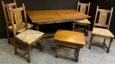 An Old Charm oak extending dining table and set of four conforming elm chairs, the table measuring