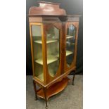 An Edwardian mahogany Vitrine or china display cabinet, shaped quarter-galleried back, break-