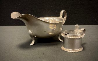 A silver sauce boat, Sheffield 1959; Victorian drum mustard pot, 1886, 157.2g in total (2)