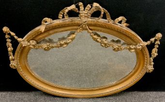 A 19th century French oval gesso and gilt wooden wall mirror, ribbon bow and floral swags detailing,