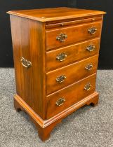 A George III style ‘campaign’ chest of drawers, draw out brushing/writing slide to top, with tan ‘