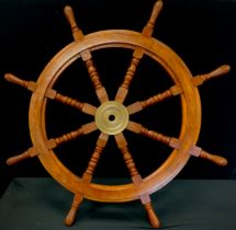 A replica wooden ships wheel, 83cm high