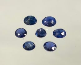 Loose Gemstones - seven mixed cut round blue sapphires, 1.13ct total stone weight.