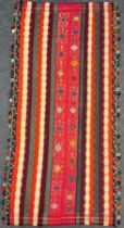 A South West Persian Jajim Kilim rug, knotted with bright colours, tasseled edge, 295cm x 135cm.