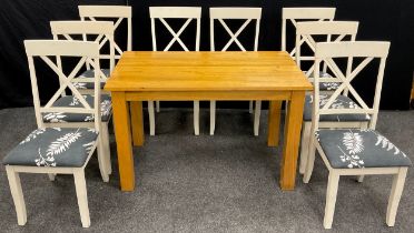 A set of eight contemporary white painted dining chairs, and a golden oak dining / breakfast