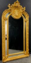 An impressive Louis XIV style ‘Baroque’, arched, gilt-wood effect mirror, 213cm high x 109cm wide.