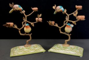 A pair of gilt metal tree stands with hand painted porcelain birds perched on the tree, faux mark,