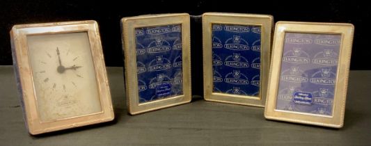 An Elkington silver fronted two section folding photograph frame, 10.5cm high, 18.5cm wide,