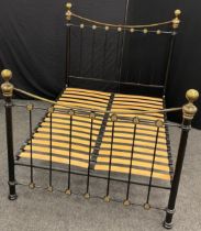 A Victorian style metal double bed frame, 149cm high at headboard x 202cm long x 137cm wide (
