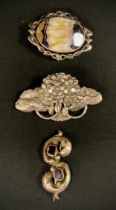 A revolving Blue John Fluorite oval panel brooch, unmarked silver metal mount, 19th century garnet