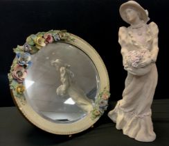 A large Alice Heath figure, as a girl with basket of flowers, 48cm high; a Barolo floral mirror,