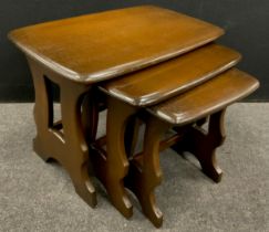 A nest of three Ercol elm tables, the largest 42cm high x 57cm x 35cm.