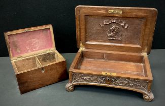 A late 19th century carved oak cigar box, c.1900; a George III mahogany rectangular tea caddy, c.