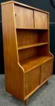 A 1970’s Danish design teak bookcase cabinet, 137cm high x 91.5cm wide x 36.5cm deep.