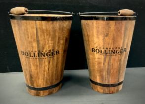 A pair of tall wooden wine buckets, marked 'Champagne Bollinger', 40cm high