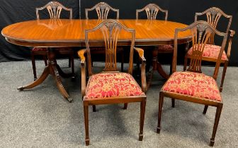 A set of six Hepplewhite style reproduction mahogany dining chairs, serpentine shaped backs with