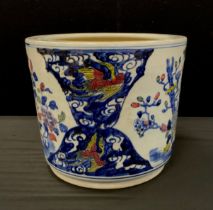 A contemporary Chinese porcelain planter decorated with exotic birds, 29cm high