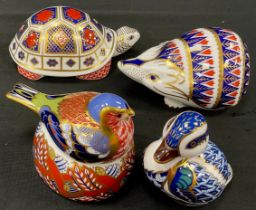 A group of four Royal Crown Derby paperweights including; Hedgehog, no stopper, Turtle, gold