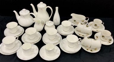 A Royal Doulton Carnation pattern tea set, inc two teapots, sugar bowl, milk jug, cups, saucers etc;