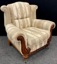 A contemporary wingback armchair, 102cm high x 107cm wide x 93cm deep.