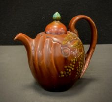 A Linthorpe Pottery shape 1246 tea pot, ovoid body, fluted moulding to the spout, bifurcated handle,
