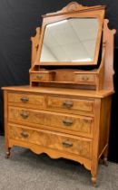 An early 20th century walnut dressing chest, 174cm high x 106.5cm wide x 49cm deep; a pair of