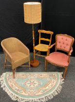 A Lloyd Loom style bedroom tub chair; 1960’s / 70’s teak standard lamp; French style walnut