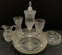 A large cut glass punch bowl, waisted body with arched hobnail cut panels, rolled lip, solid foot,