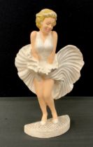 A cast iron door porter of Marilyn Monroe, 34cm high