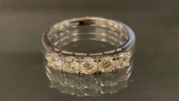 A diamond five stone ring, linear set with round brilliant cut diamonds, total estimated diamond
