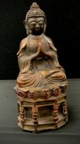 A Chinese bronzed coloured metal figure of sitting buddha, 30cm high