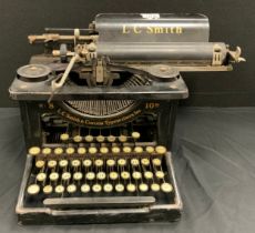 A 1920s/30s L C Smith and Corona typewriter and cover