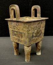 A bronzed metal Chinese twin handled archaic style koro, 24cm high