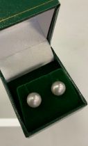 A pair of grey cultured pearl earrings, 9ct gold mounts, Pillar fittings, 0.9cm diameter, 2,6g gross