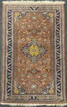 A Middle Eastern Nain style rug, knotted with a central diamond shaped medallion within a field of
