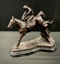 A bronzed metal figure group of horse and jockey, mounted on metal plinth, 33cm high