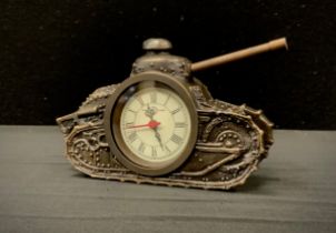 A novelty desk clock as a tank, roman numerals, 16cm long