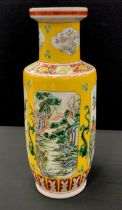 A 20th century Chinese yellow porcelain vase decorated with panels of oriental scenes, 44cm high
